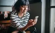 A woman on her smartphone.