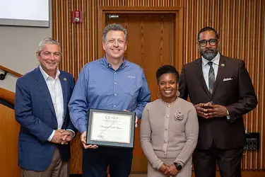 Virginia Credit Union accepting the Henrico County Department of Outreach & Engagement’s inaugural Heart of Service Award