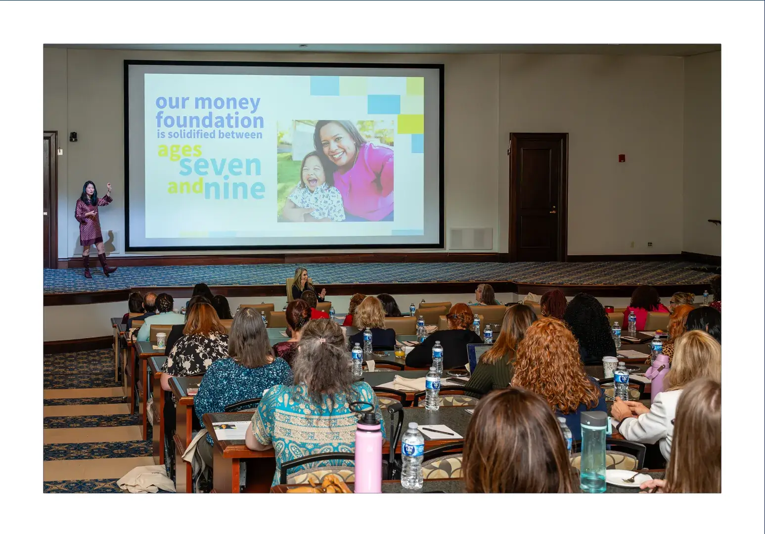 Cherry Dale speaking on stage at VACU's Financial Success for Women Summit